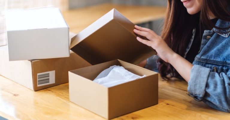 beautiful-young-asian-woman-receiving-opening-postal-parcel-box-home-delivery-online-shopping-concept_9563-5568